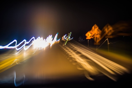 Blurred street lights and signs to represent impaired driving